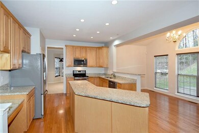 The kitchen is loaded with amenities, including an