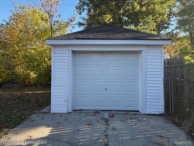 Garage featuring driveway