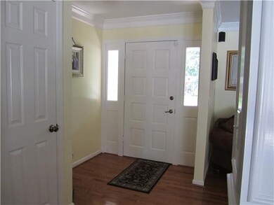 Entry way - you are greeted by hardwood floors and open concept into living room, dining room and den!