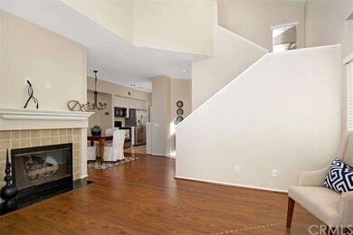 Open concept floorplan with laminate wood floors a
