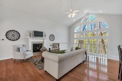 Bright open great room with hardwood floors, wood 