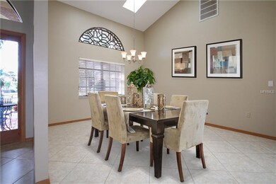 The formal dining room features tiled floors and s
