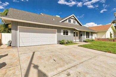Large driveway and street level front entrance