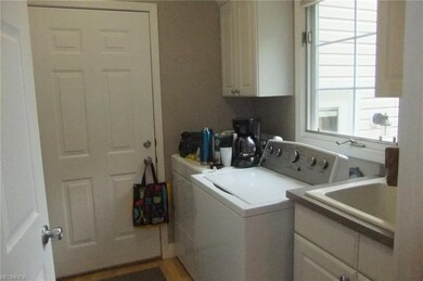 1st floor laundry room with double stacked cabinet
