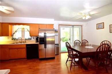sliding glass doors off the kitchen lead to the re
