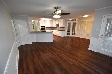 Kitchen featuring dark hardwood / wood-style floor