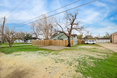 Another view of the fully fenced exterior with ple
