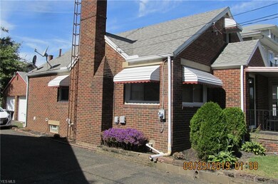 Another view of home from side with 2 car garage
