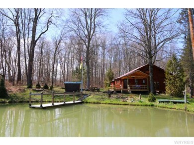 Exterior Front. 12 foot deep stocked pond