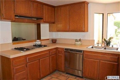 Sunny gourmet kitchen with stainless steel applian