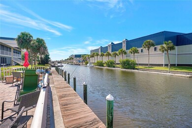 Dock area with a water view and a residential view
