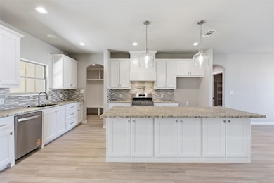 Granite countertop, gas cooktop