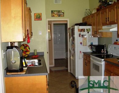 Kitchen. Galley kitchen with double sinks, all app