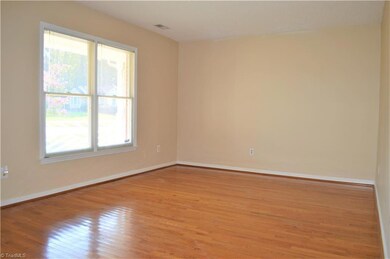 Gleaming hardwood floors and freshly painted make this living room with great natural light a perfect place to relax and entertain!