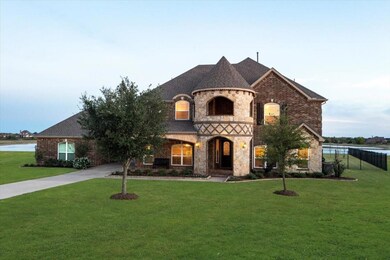 Gorgeous curb appeal with porte-cochere and 5 car 