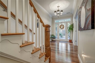 Entrance showing chandelier and ornamental molding