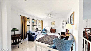 Front living room with large windows offers plenty of space for larger furniture or could be a formal dining area.