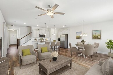 Living room featuring ceiling fan with notable cha