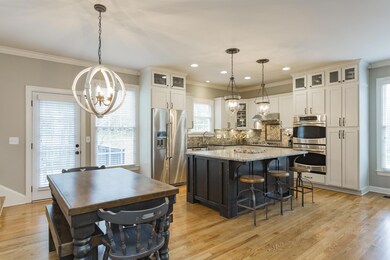 Open concept with eat-in kitchen, den and laundry all one space- functional floor plan and great for entertaining