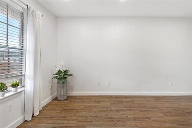 Unfurnished room featuring wood finished floors a