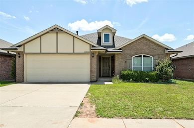 View of front of house featuring a 2 car garage, concrete driveway, and beautiful front yard.