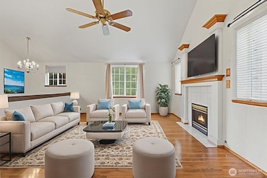 Enjoy a spacious family room with vaulted ceilings a cozy fireplace, and lots of light throughout! Note: Virtually staged.