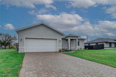 Single story home with central AC, a garage, and a