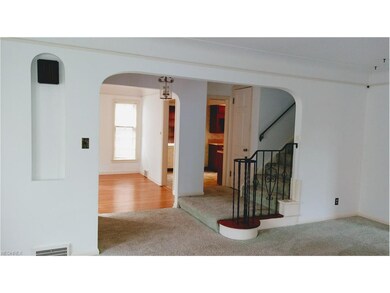 Arched entry  Living room view of dining room and 