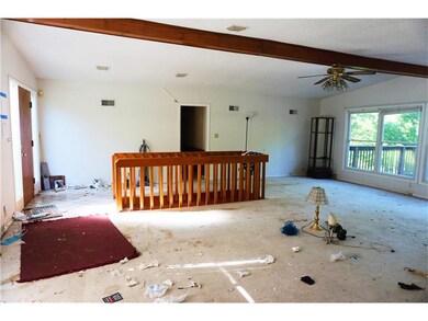 FRONT ENTRY AND STAIRS TO THE BASEMENT.