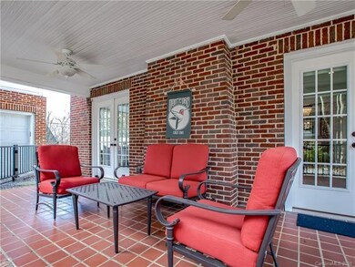 Covered side porch thats fenced to back yard