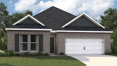 View of front of house with a garage and a front l