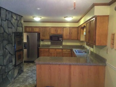 Kitchen with newer stainless steel appliances. 