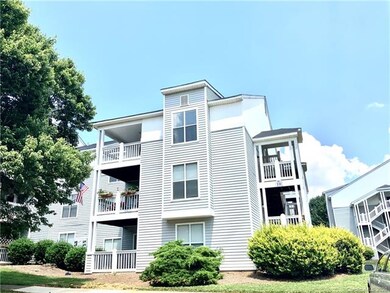 Bottom level condo with covered patio area.