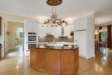 KITCHEN with Hardwood, Granite, Jenn-Air Gas Cookt