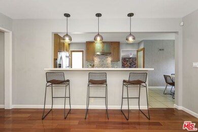 leather bar stools courtesy of Emily Johnson, The Loved House