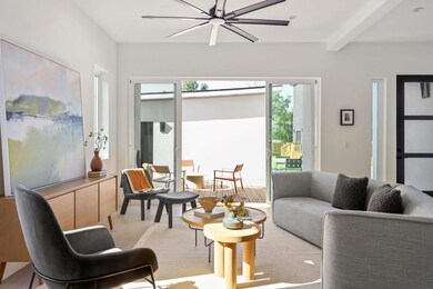 Living room featuring beamed ceiling