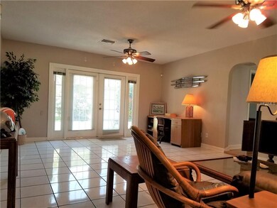 A roomy, spacious living area greets you upon open