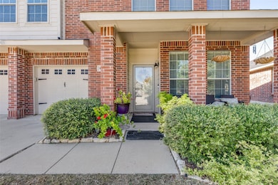 Property entrance with brick siding and covered porch