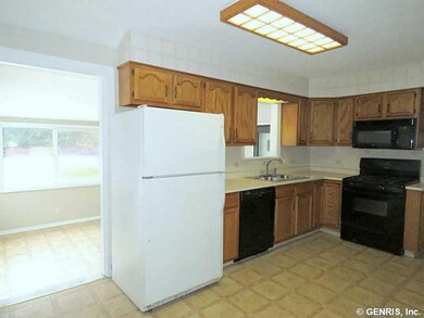 Kitchen. Kitchen with rich Oak cabinetry & applian