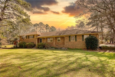 View of front of house featuring brick siding, cra