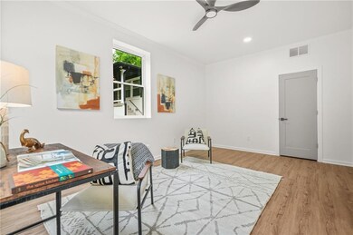 Downstairs bedroom featuring LVP flooring, baseboards, recessed lighting