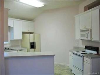 Open and lots of natural light in this kitchen. Ow