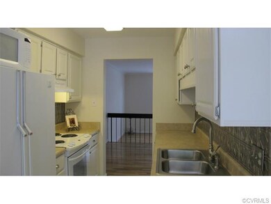 Kitchen open to both the formal dining area and ea