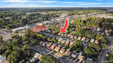 Aerial view of property's location featuring nearby suburban area