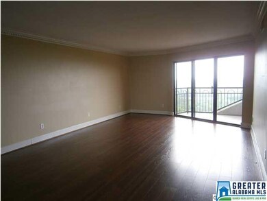 Living room with hardwood floors. Dining room is b