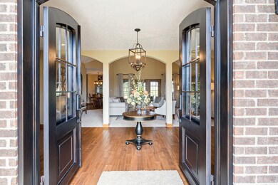 Double steel doors welcome you to this beautiful custom home