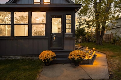 Well-lit walkway introduces the home