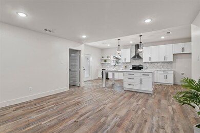 Kitchen with decorative backsplash, open shelves, 