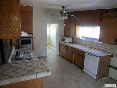Very open kitchen looks out on to living room