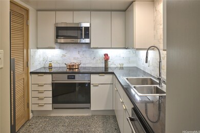 Kitchen with high-end appliances, custom backsplas